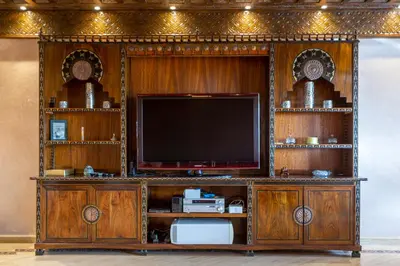 a large entertainment center with a flat screen tv at Appart de luxe Hivernage Menara Mall Gueliz in Marrakech