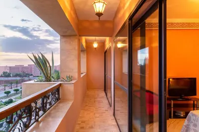 a balcony with a view of the city at Appart de luxe Hivernage Menara Mall Gueliz in Marrakech