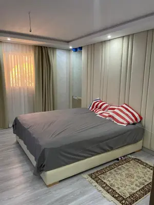 a bedroom with a large bed in front of a window at House of Jade Marrakech in Marrakech
