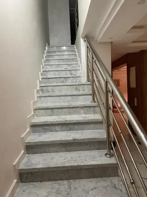 a set of stairs in a building withsteel railing at House of Jade Marrakech in Marrakech