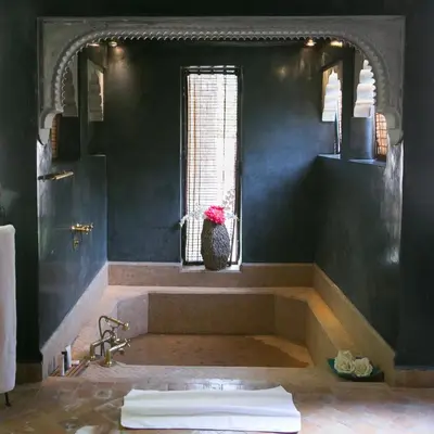 a bathroom with a bath tub and a window at Lodge K in Marrakech