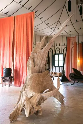 a large wooden object sitting on the floor in a room at Lodge K in Marrakech