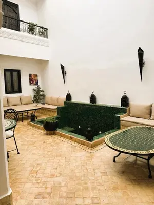 a living room with a couch and a table at Dar Nossa in Marrakech