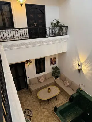 a living room with a couch and a table at Dar Nossa in Marrakech