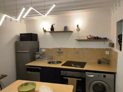 a kitchen with a sink and a refrigerator at RZ22, 5 min de Jemaa El Fna, 4 Pers, Fibre Optique Wi-Fi in Marrakech