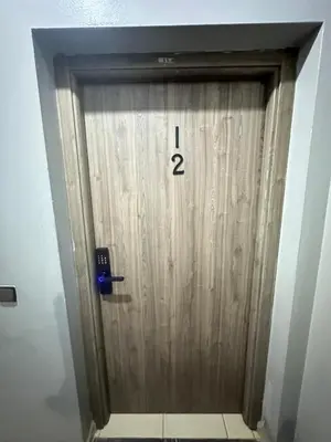 a wooden door with the number one on it at charming room close to Marrakech airport in Marrakech