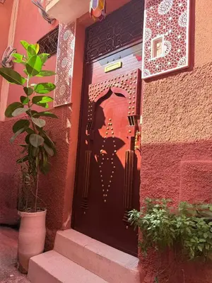 a door with a picture of a person on it at marrakesh riad in Marrakech