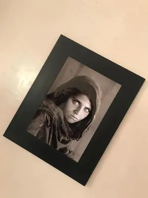 a black and white picture of a woman in a hijab at APP. Traversant au GUELIZ + Piscine sur le toit in Marrakech