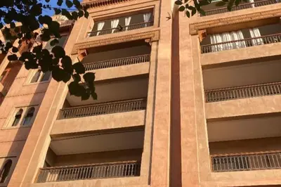 a building with balconies on the side of it at Appartement centre Guéliz avec terrasse spacieuse in Marrakech