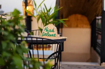 a hat sitting on top of a table at Riad Deluxe in Marrakech
