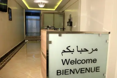 a welcome sign in a hallway with a welcome banner at Hotel Ichbilia فندق اشبيلية in Marrakech