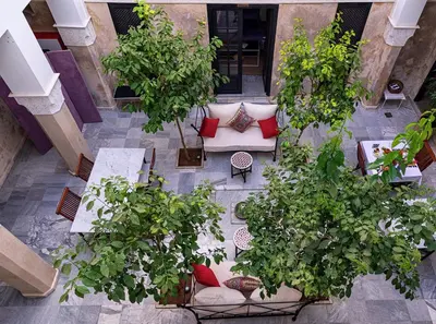 an overhead view of a patio with trees and a couch at Riad Sapphire & Spa in Marrakech