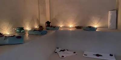 a room with candles and towels on a shelf at Riad Sapphire & Spa in Marrakech