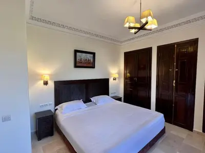 a bedroom with a large white bed in a room at The Majestic Marrakesh Villa 2 in Marrakech