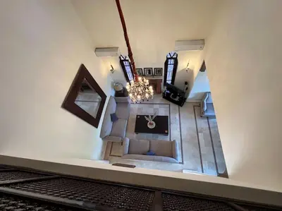an overhead view of a living room with a chandelier at The Majestic Marrakesh Villa 2 in Marrakech