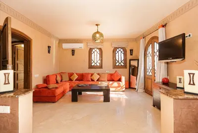 a living room with a couch and a table at Luxury Villa 6 ROOMS with Pool - Marrakech Center in Marrakech