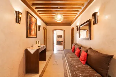 a living room with a couch and a table at Luxury Villa 6 ROOMS with Pool - Marrakech Center in Marrakech