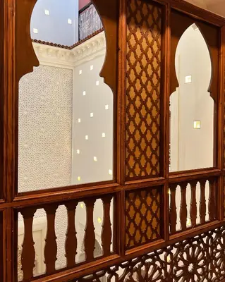 a view through a glass window of a balcony at Riad Dar Yammi in Marrakech