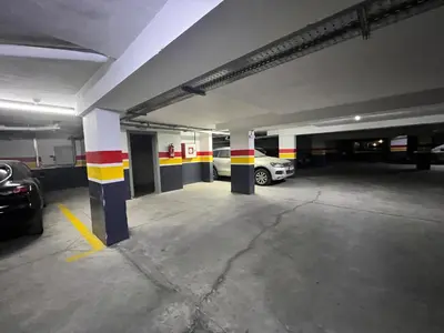 an empty parking garage with cars parked in it at Appart avec Piscine, Riad Garden in Marrakech