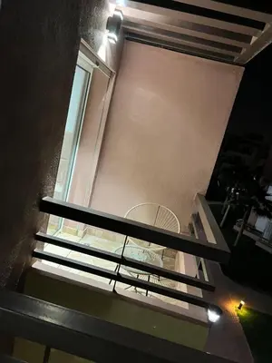 a view from the top of a building with a window at Appart avec Piscine, Riad Garden in Marrakech