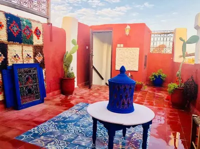 a room with a blue vase sitting on a table at Maison Alegria , Heart of Medina in Marrakech