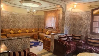 a living room with a couch and a table at Stay with low budget in Marrakech
