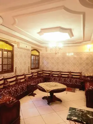 a large room with a table and chairs at Stay with low budget in Marrakech