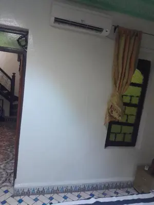 a room with a wall with a heater and a window at RIAD FOUZIA in Marrakech