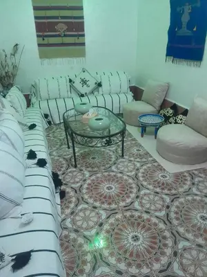 a living room with a couch and a table at RIAD FOUZIA in Marrakech