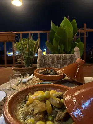 a table with a plate of food on a table at Riad Hanya in Marrakech