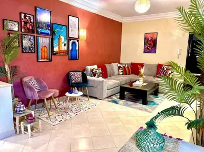 a living room with a couch and chairs at Appartement Marrakech Hivernage N54 RESIDENCE CAPRICE PALACE in Marrakech