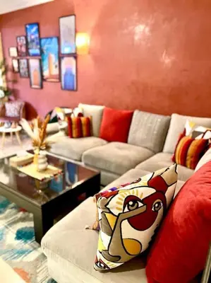 a living room with a couch and a table at Appartement Marrakech Hivernage N54 RESIDENCE CAPRICE PALACE in Marrakech