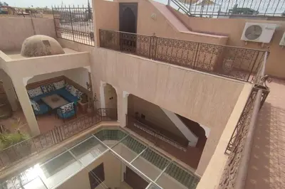 an aerial view of a building with a swimming pool at RIAD PRIVATISÉ 3 Chambres 6 Personnes Place Jemma El Fna in Marrakech