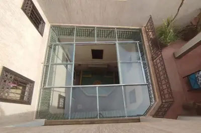 a glass window on the side of a building at RIAD PRIVATISÉ 3 Chambres 6 Personnes Place Jemma El Fna in Marrakech