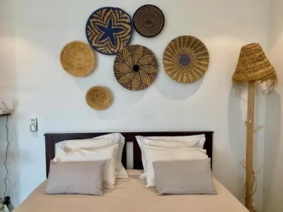 a room with a bed with plates on the wall at STUDIO MODERNE PROCHE MACDO RTE CASA in Marrakech