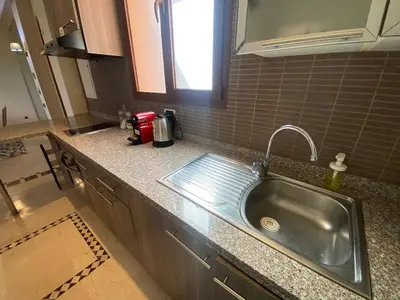 a kitchen with a sink and a counter top at Appartement Privé 1 Chambre Vizir Center Marrakech in Marrakech