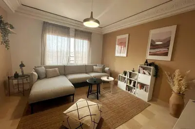 a living room with a couch and a table at Sunny terrace & comfy beds in Marrakech in Marrakech
