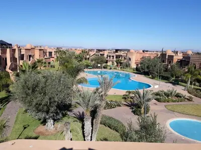 an aerial view of a resort with two pools at Marrakech Atlas Golf Resort appartement 2 chambres,Piscines in Marrakech