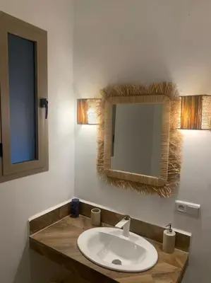 a bathroom with a sink and a mirror at Magnifique villa sans vis-à-vis • Marrakech in Marrakech
