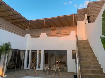 a white house with a patio and stairs at Magnifique villa sans vis-à-vis • Marrakech in Marrakech