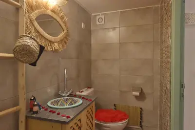 a bathroom with a sink and a toilet in it at RIAD CHOUKRI in Marrakech