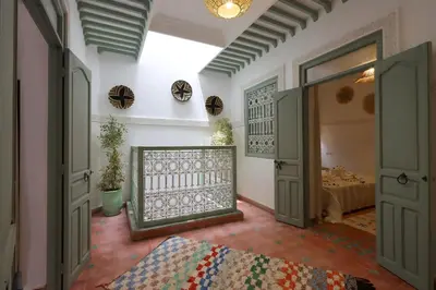 a room with a door and a bedroom with a bed at RIAD CHOUKRI in Marrakech