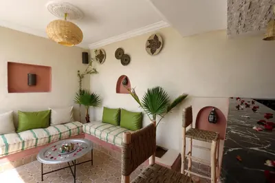 a living room with a couch and a table at RIAD CHOUKRI in Marrakech
