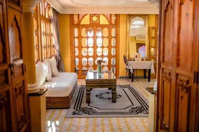 a living room with a couch and a table at Penthouse Marrakech in Marrakech