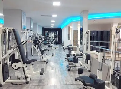 a gym with several treadmills and machines in a room at Penthouse Marrakech in Marrakech