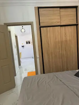 a bedroom with a bed and a door to a hallway at Marrakesh manara in Marrakech