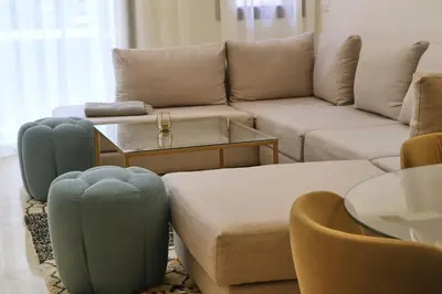 a living room with a couch and a table at Menara Duplex in Marrakech