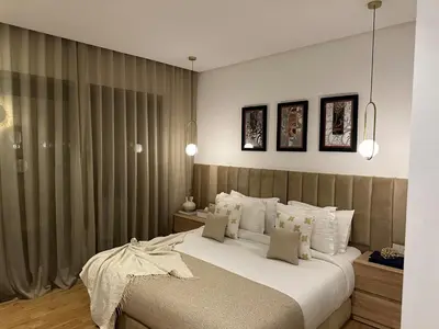 a bedroom with a large bed with white pillows at S_house in Marrakech
