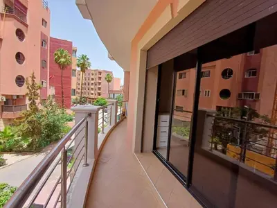 a balcony with a view of a building at stylish appartment heart of gueliz in Marrakech
