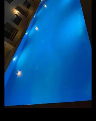 a blue pool with lights on top of it at Glorieux appartement à gueliz in Marrakech